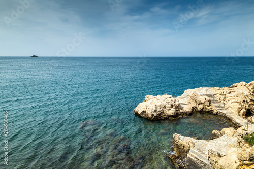 Rocky coast of the Adriatic Sea at Rovinj town in Croatia, Europe.