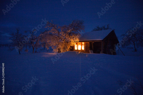 Fototapeta wilderness hut on a skiing route in lappland