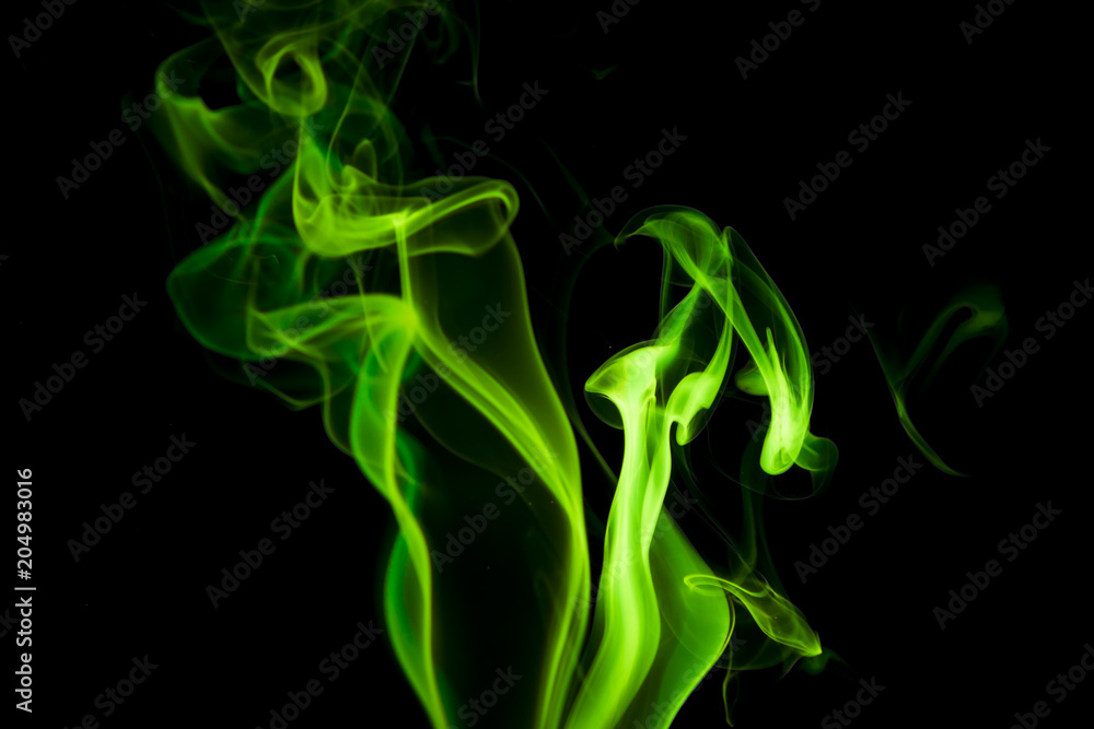 Green smoke on black background Green smoke on black background