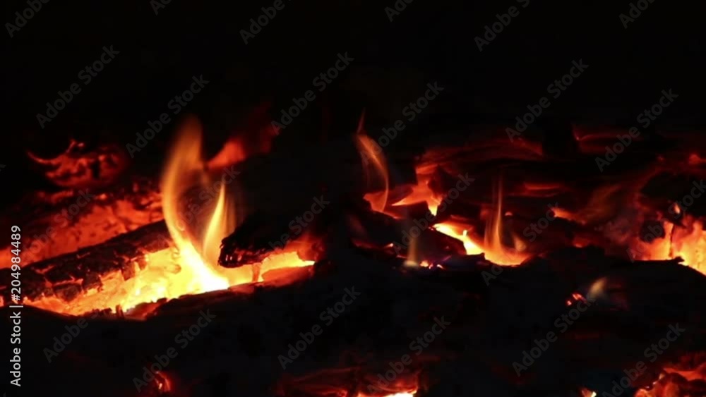 Hot coals and fire flames in fireplace, bonfire close-up. Hot coals and fire flames in fireplace, bonfire close-up.