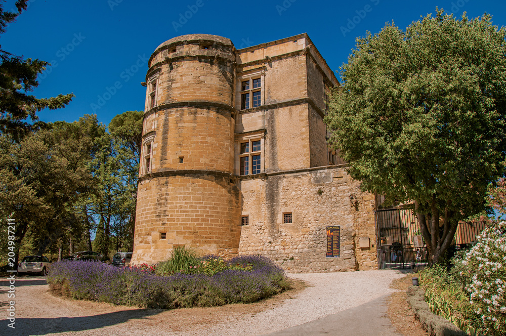 View of the Lourmarin Castle with lavender bush in front, near the village of Lourmarin. In the Vaucluse department, Provence-Alpes-Côte d'Azur region, southeastern France View of the Lourmarin Castle with lavender bush in front, near the village of Lourmarin. In the Vaucluse department, Provence-Alpes-Côte d'Azur region, southeastern France