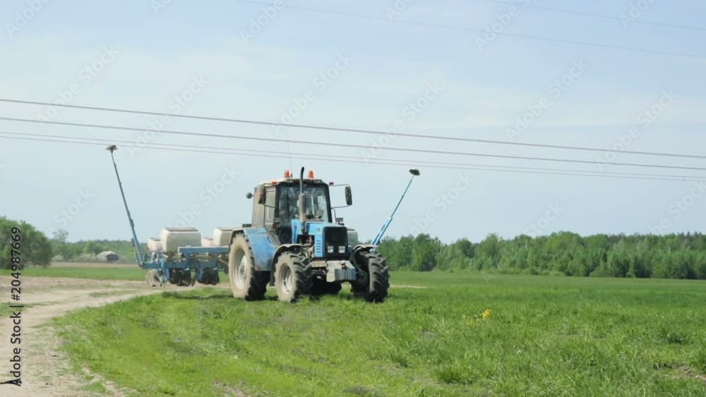 Tractor rides with the sowing unit. Preparation for sowing Tractor rides with the sowing unit. Preparation for sowing