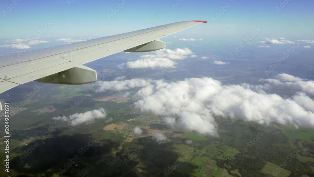 View from the window of the plane. Flight over the ground. View from the window of the plane. Flight over the ground.