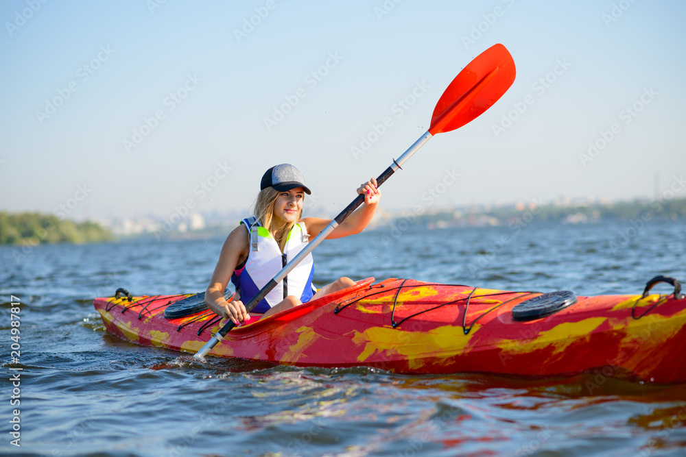 Young Professional Woman Kayaker Paddling Kayak on River under Bright  Morning Sun. Sport and Active Lifestyle Concept foto de Stock | Adobe Stock