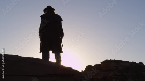 Cowboy Silhouette with pistols in hands