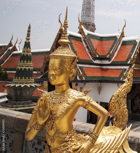 Gold Buddha statue in Wat Phra Kaew, Royal Palace, Bangkok (Krung Thep), Thailand, Asia. Temple of the Emerald Buddha is the most important Buddhist temple in Thailand. 