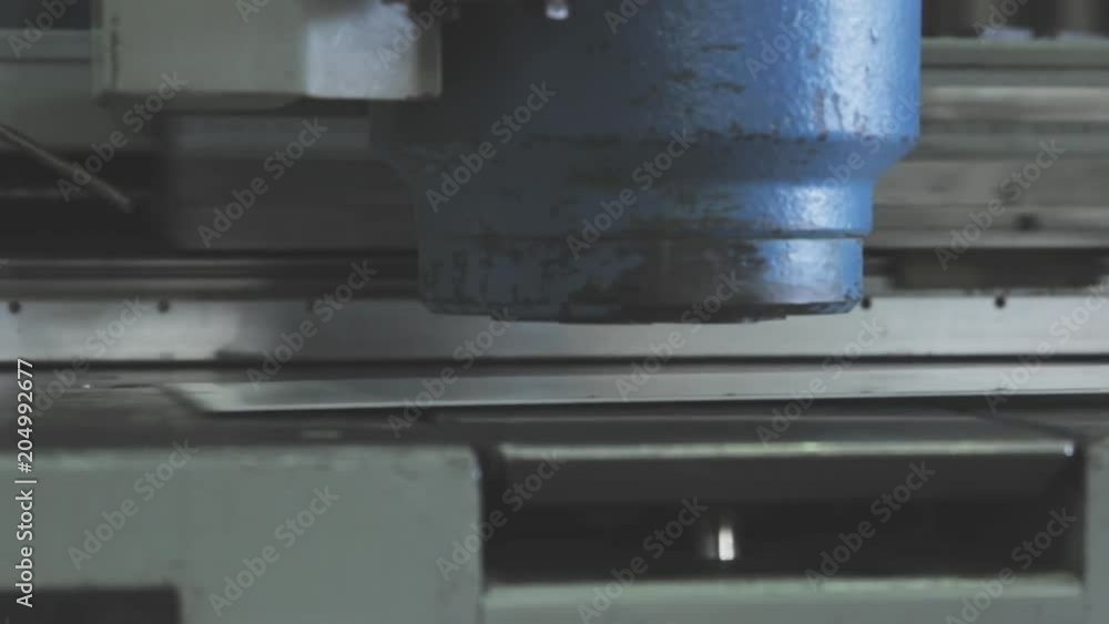 Machine presses metal, close up Machine presses metal, close up