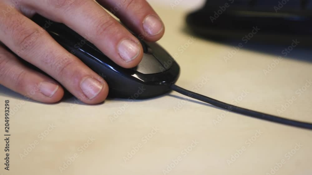 Close up, person uses computer mouse Close up, person uses computer mouse