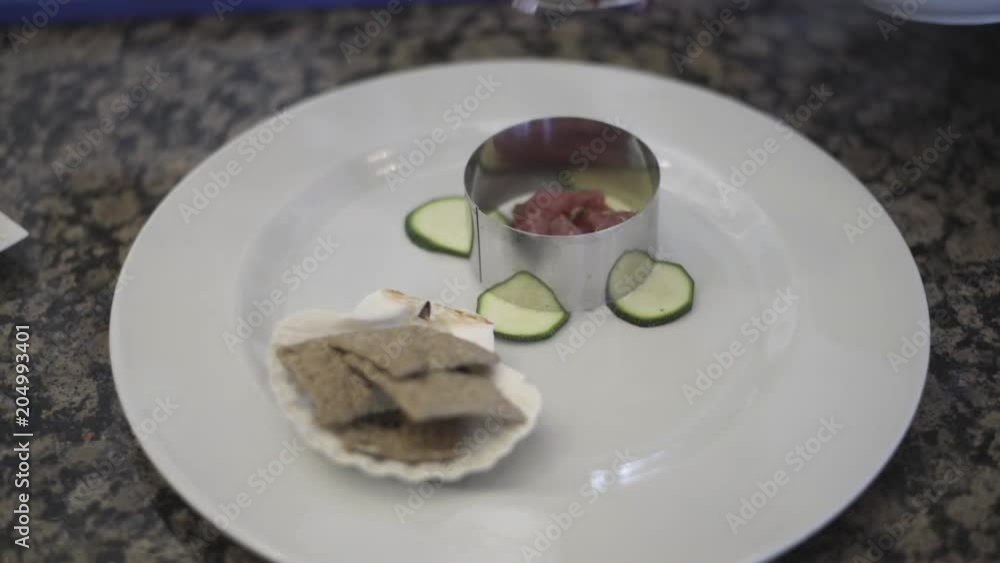 Close up, crackers and raw fish on plate Close up, crackers and raw fish on plate
