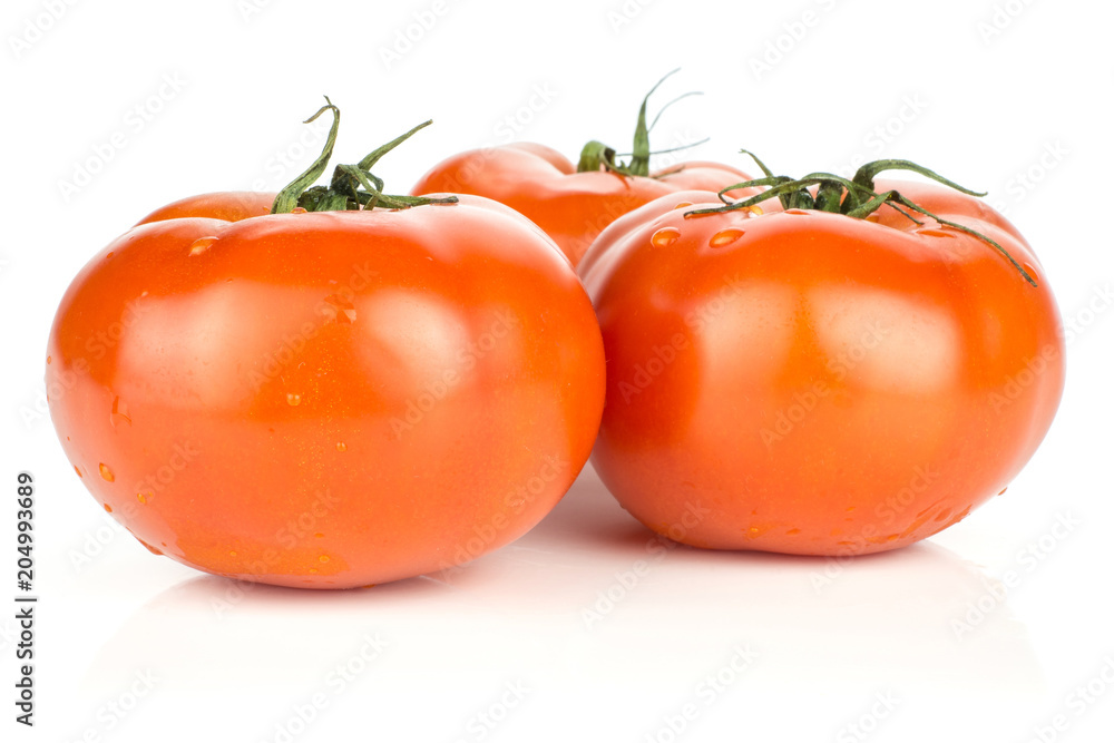 Three red tomato with vine ends isolated on white background fresh whole.