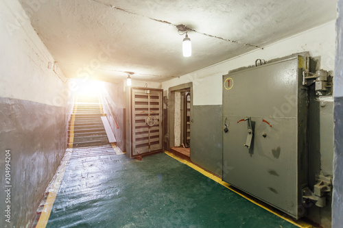 Billede på lærred Hermetic metal armored doors with valves in  the entrance of soviet bomb shelter