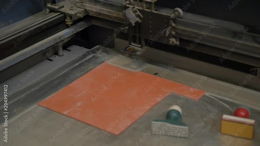 Machine cuts metal with laser, close up Machine cuts metal with laser, close up