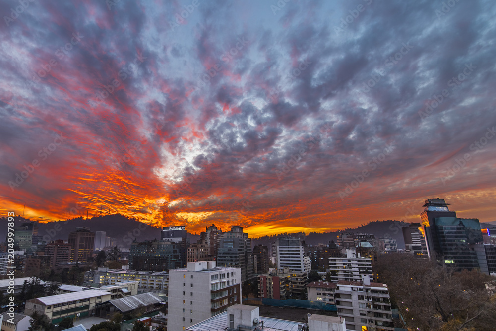 Obraz premium Sunset over Santiago de Chile city, an amazing and colorful skyline