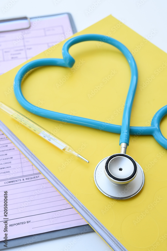close up of stethoscope and thermometer for background close up of stethoscope and thermometer for background