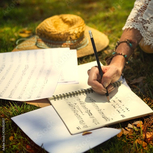 Принти на полотні Woman writing a lyric in a notebook