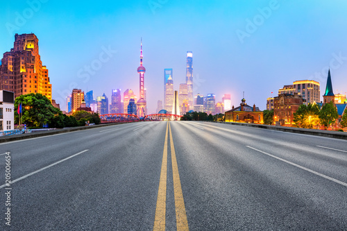 clean asphalt road with city skyline background shanghai china