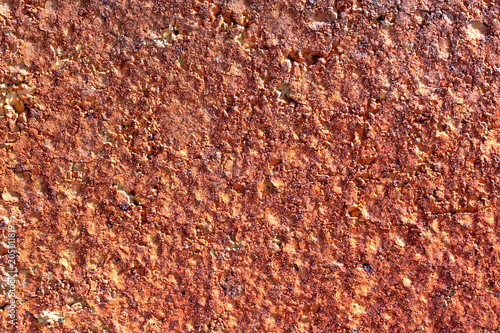 texture of wall covered with rogh plaster and painted in red and yellow color