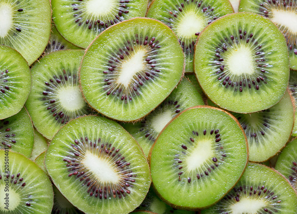 heap of sliced kiwi as textured background heap of sliced kiwi as textured background
