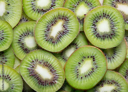 heap of sliced kiwi as textured background