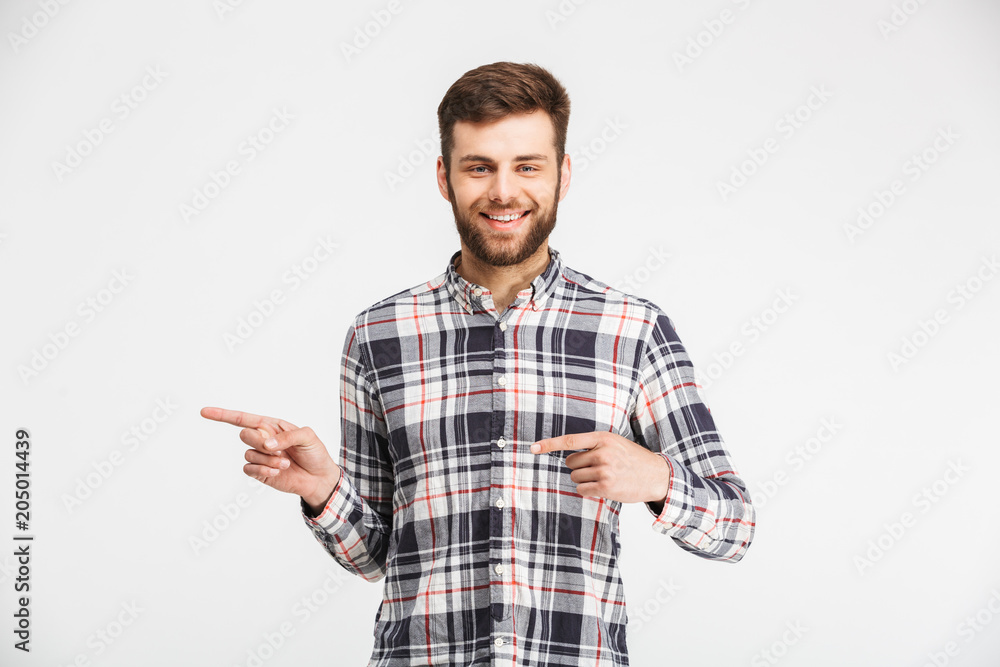 Portrait of a cheerful man pointing fingers Portrait of a cheerful man pointing fingers