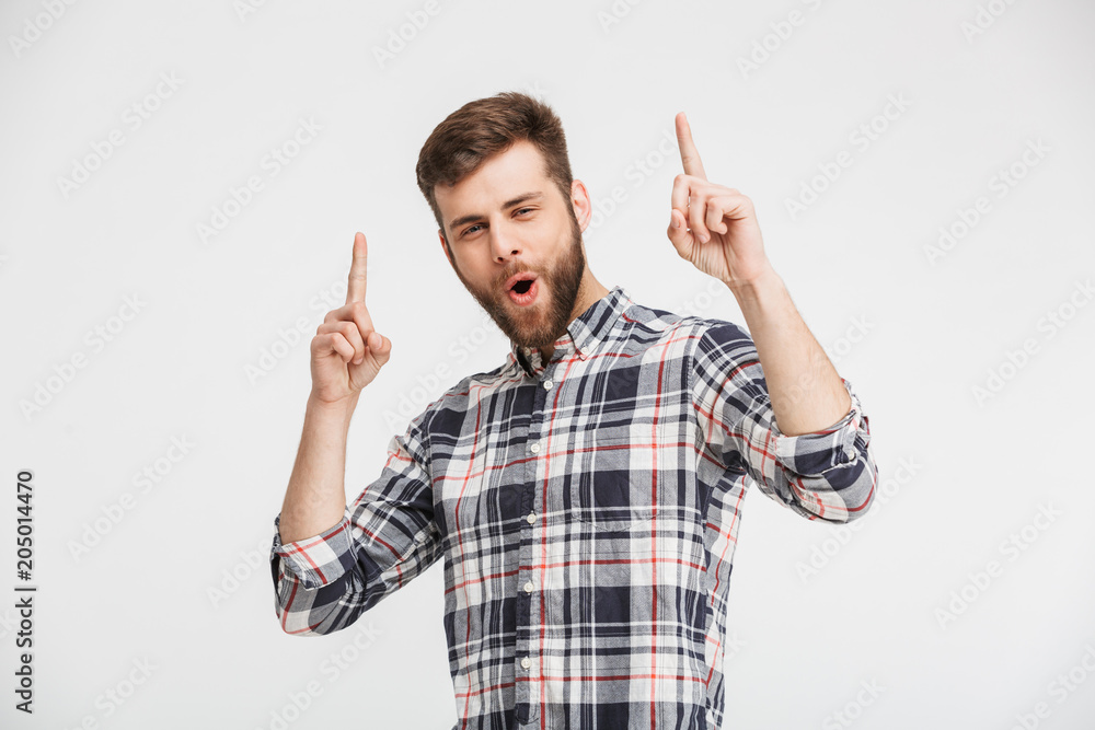 Portrait of an excited man pointing Portrait of an excited man pointing
