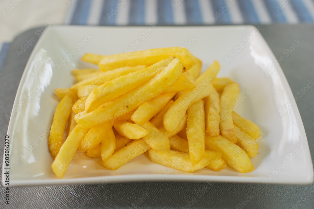 Close up snack and Dessert, Delicious Salted Crispy Breadsticks, French fries in a dish on table background. Close up snack and Dessert, Delicious Salted Crispy Breadsticks, French fries in a dish on table background.