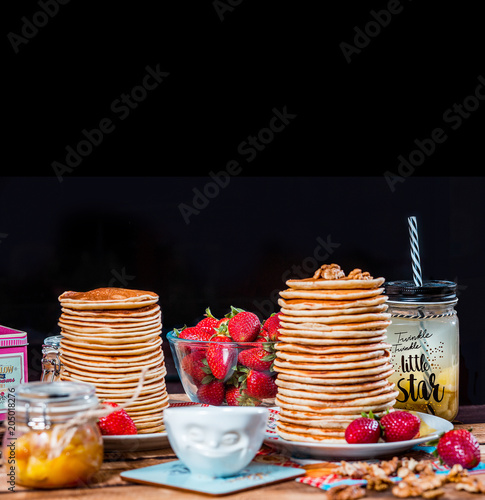 Pancakes with strawberry,walnut and caramel for a breakfast. photo