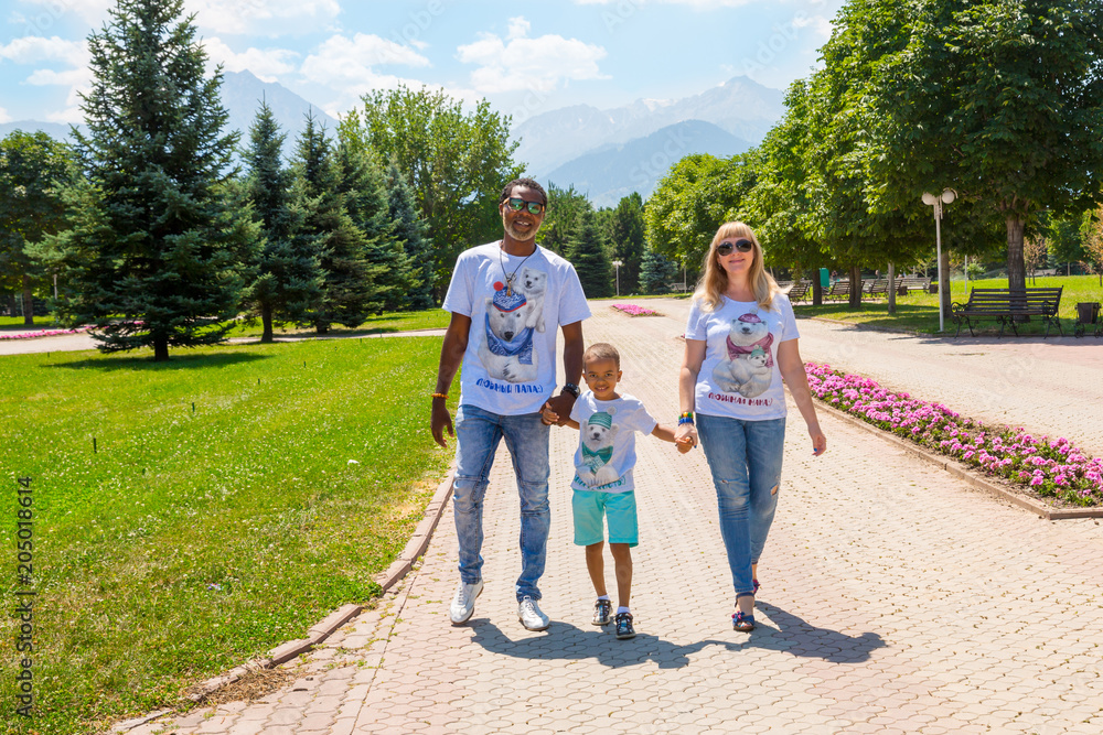 African American happy family: black father, mom and baby boy on nature. Use it for a child, parenting or love concept African American happy family: black father, mom and baby boy on nature. Use it for a child, parenting or love concept
