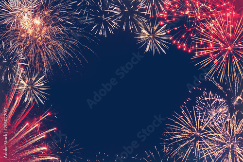 Stars of the fireworks are on a dark blue background photo