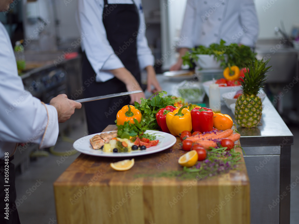 cook chef decorating garnishing prepared meal cook chef decorating garnishing prepared meal
