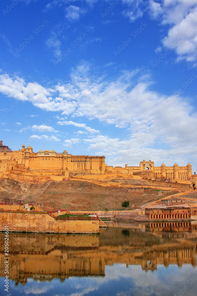 Amber Fort reflected in Maota Lake near Jaipur, Rajasthan, India.