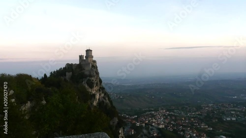 Mountain fortress, Time lapse view of Guaita castle, on a earley sunny autumn morning dusk, in San Marino city photo