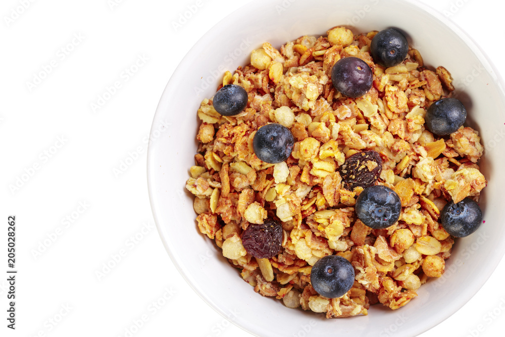 Bowl of homemade granola with fruit pieces isolated on white Bowl of homemade granola with fruit pieces isolated on white