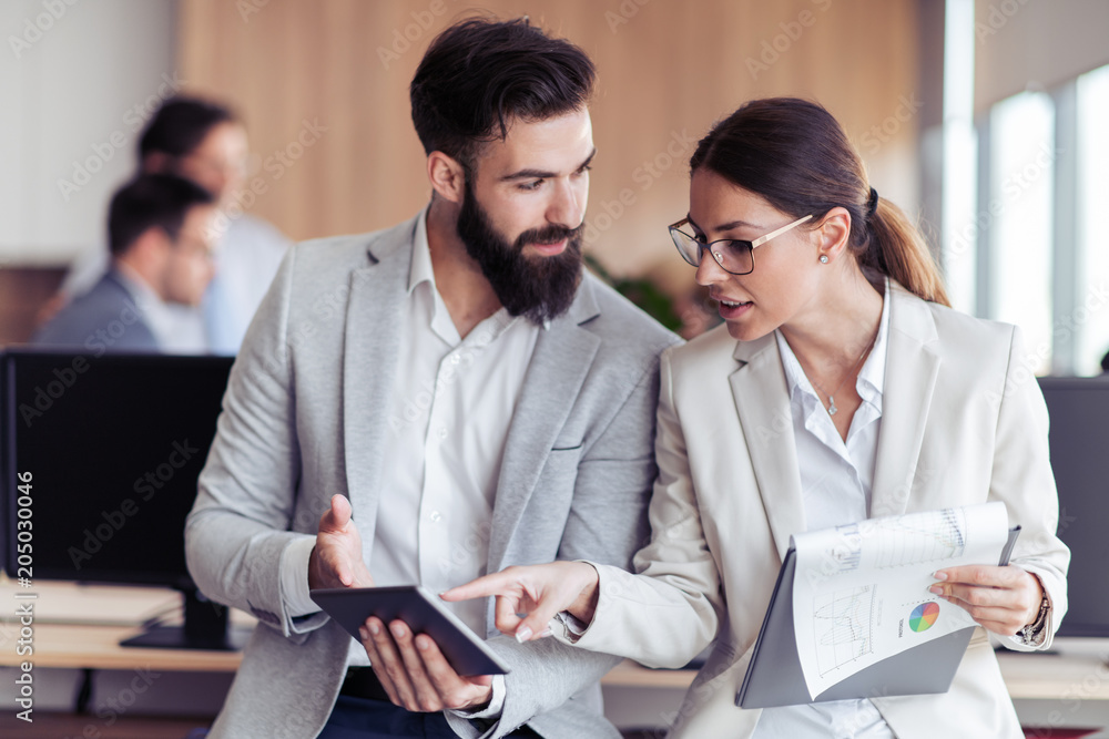 Fototapeta premium Young professionals work in modern office