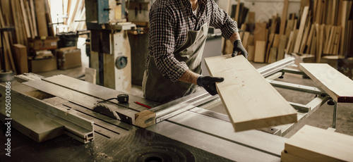 Skilled Carpenter craftsman at work in his workshop