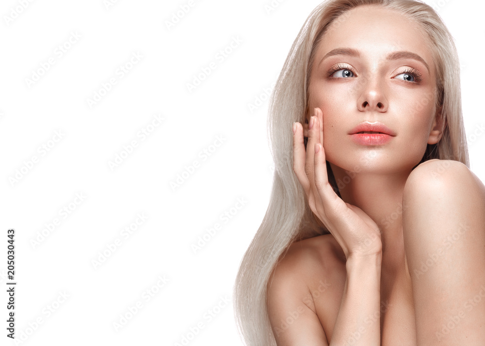 Beautiful young girl with a light natural make-up and perfect skin. Beauty face. Picture taken in the studio on a white background. Beautiful young girl with a light natural make-up and perfect skin. Beauty face. Picture taken in the studio on a white background.