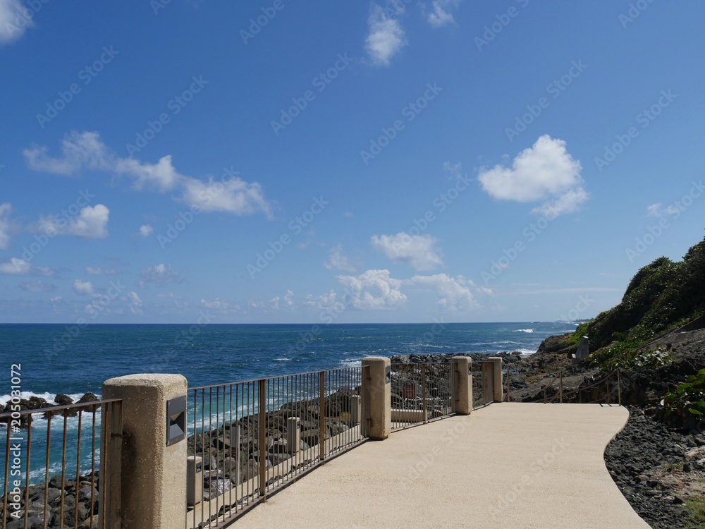 Paved walkway with railings at the back walkway at Fort El Morro in Old San Juan, Puerto Rico.  