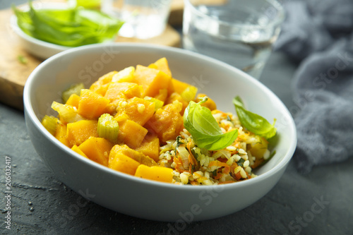 Pumpkin stew with rice and fresh basil