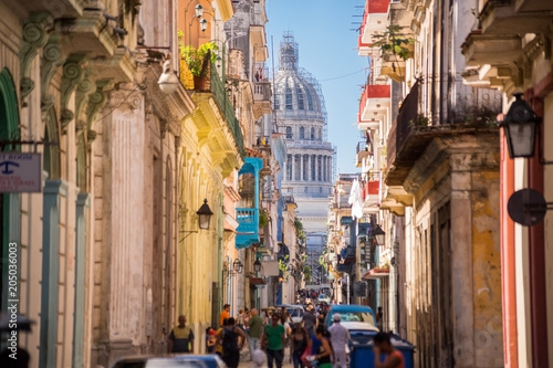 Havana, Cuba, El Capitolio seen from a narrow street
