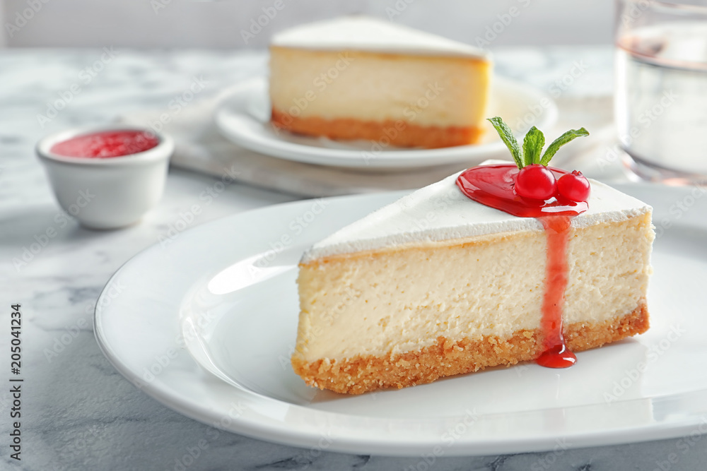 Delicious cheesecake served with sweet jam on plate Delicious cheesecake served with sweet jam on plate