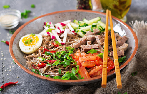 Buckwheat noodles  with beef, eggs and vegetables. Korean food.  Buckwheat pasta soup.