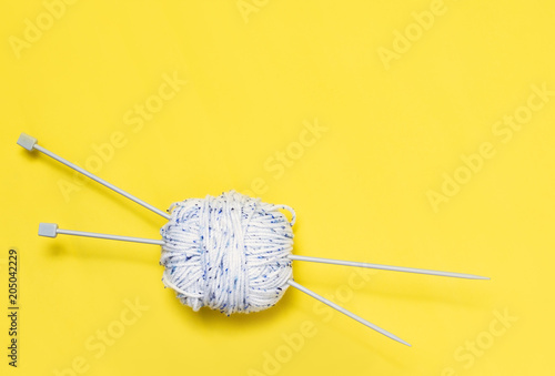 Top view of yarn on yellow background