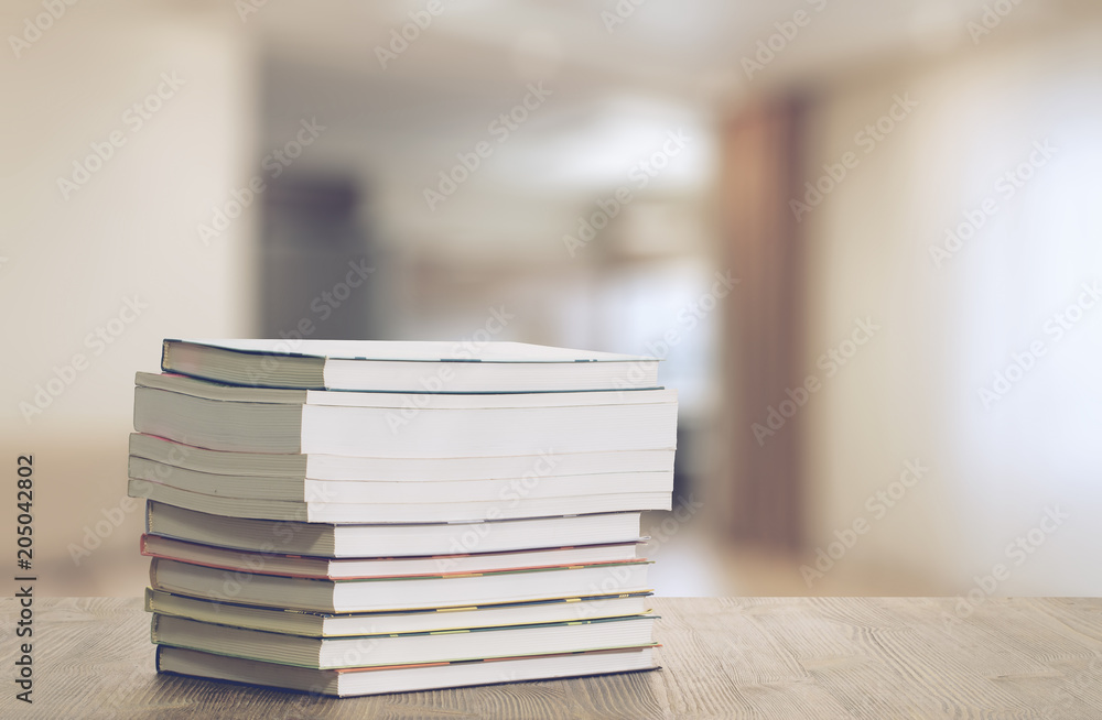 books on wooden table books on wooden table
