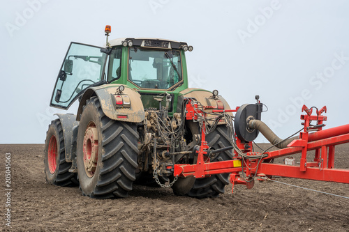 rear of a modern tractor with a trailing unit for sowing