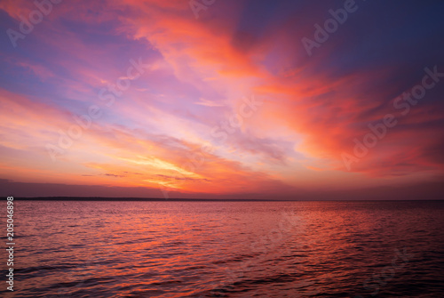 Magic orange and red sunset over sea. Sunrise over Beach © es0lex