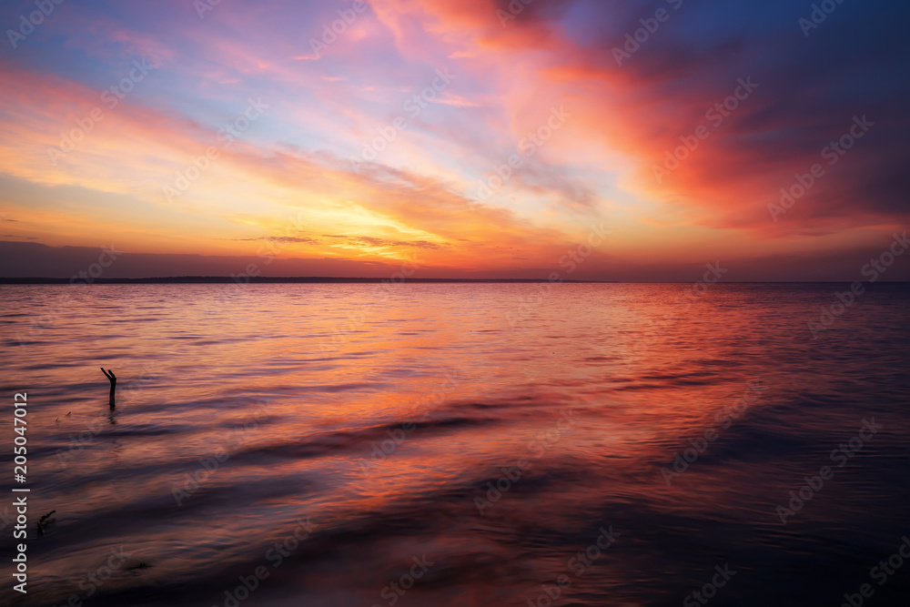 Magic orange and red sunset over sea. Sunrise over Beach