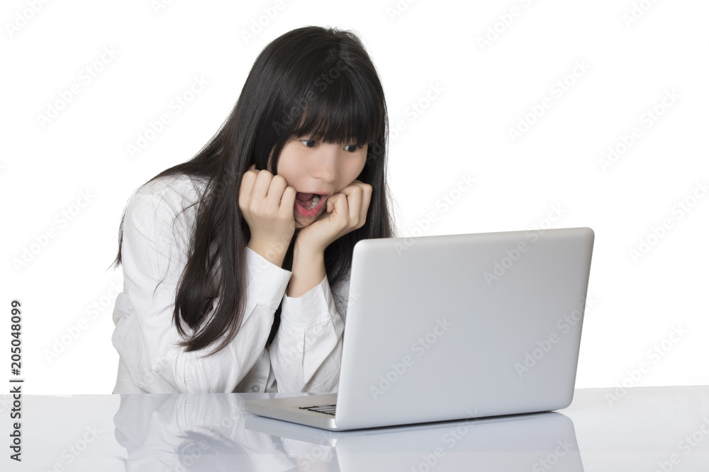 Asian woman sitting at desk stressed isolated on white background Asian woman sitting at desk stressed isolated on white background