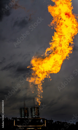 Fire from a gas flash on a dark background blur