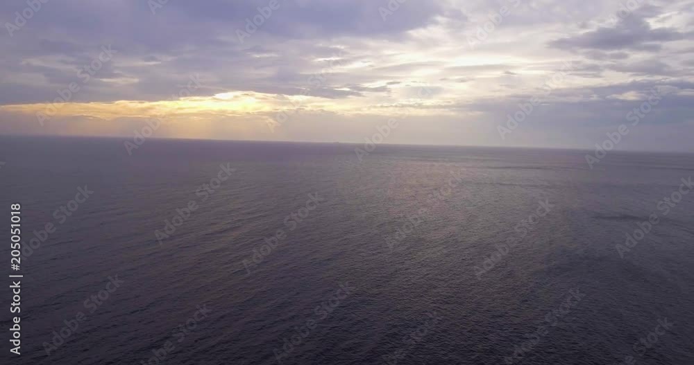 Aerial, beautiful calm sea in the evening and overcast sky Aerial, beautiful calm sea in the evening and overcast sky