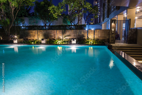 Lighting business for luxury backyard swimming pool.  Relaxed lifestyle with contemporary design by professionals. © Travis